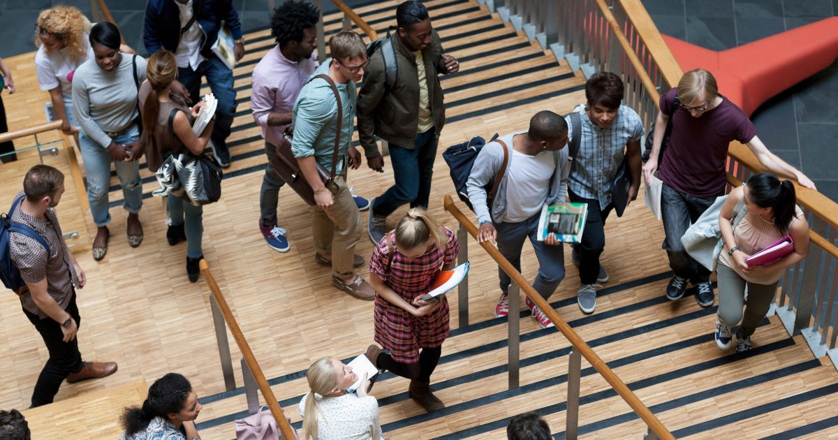 A group of students walking up the steps