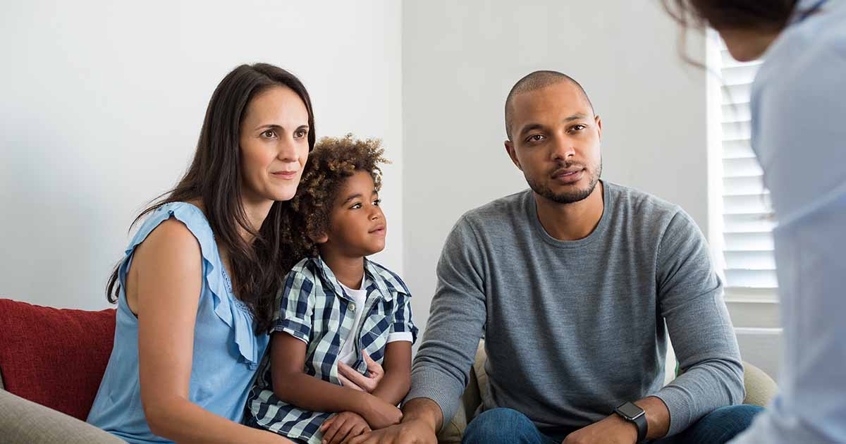 child-staring-with-parentsAdobeStock